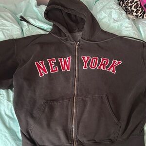 Brandy Melville Black Zip Hoodie with Red 'NEW YORK' Lettering